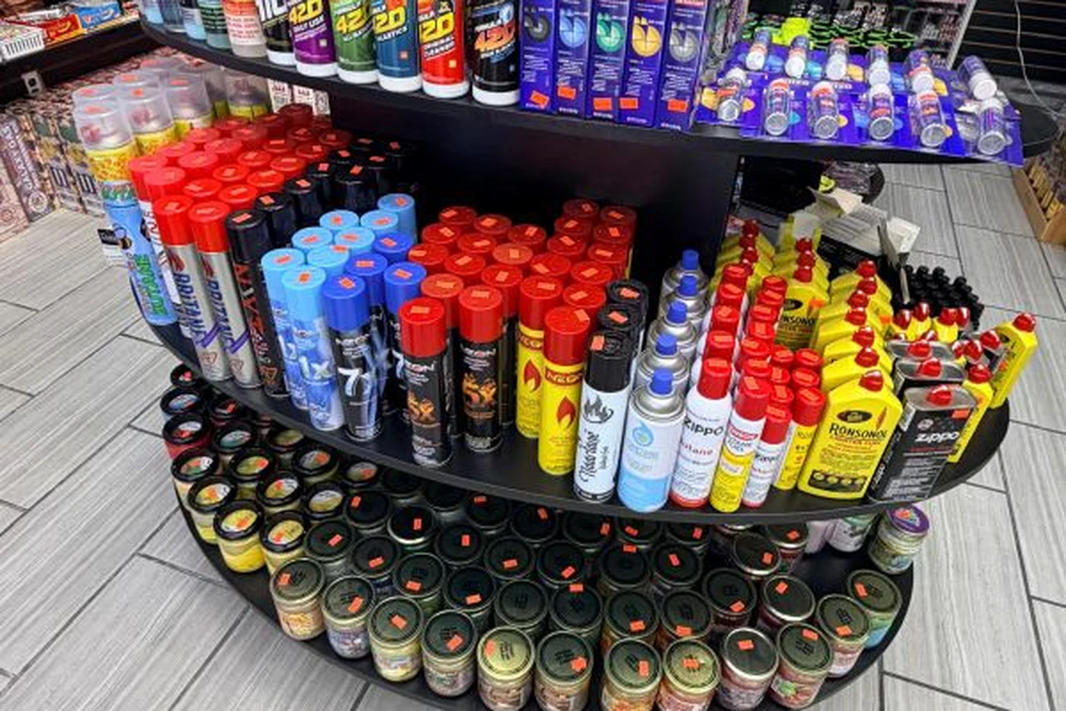 Lighters, grinders, butane, and smoking accessories on display at Midwest Smoke Shop on Dodge Street