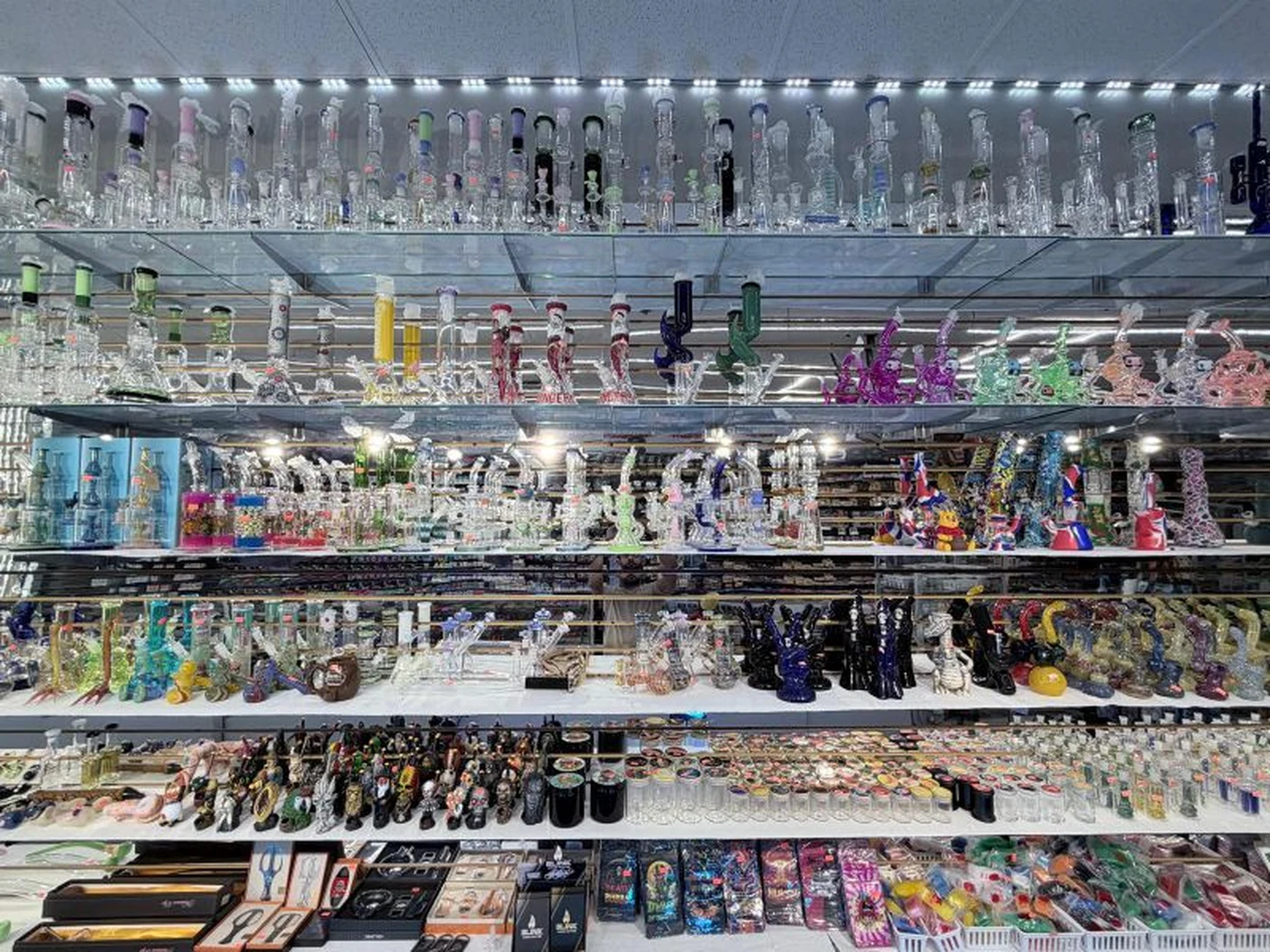 Glass water pipes, hand pipes, and hookahs on display at Midwest Smoke Shop on Dodge Street